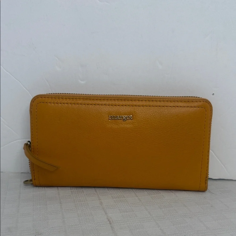 Margot Anna Zip Around Leather Wallet in marigold yellow.